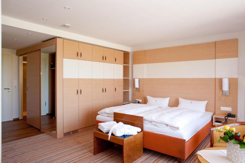 Postel nebo postele na pokoji v ubytování Janssens Hotel