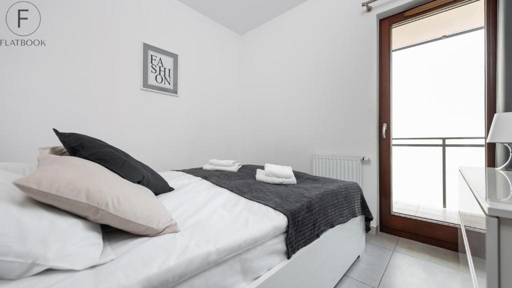 Posteľ alebo postele v izbe v ubytovaní Flatbook - City Center SPA Apartments Toruńska 11