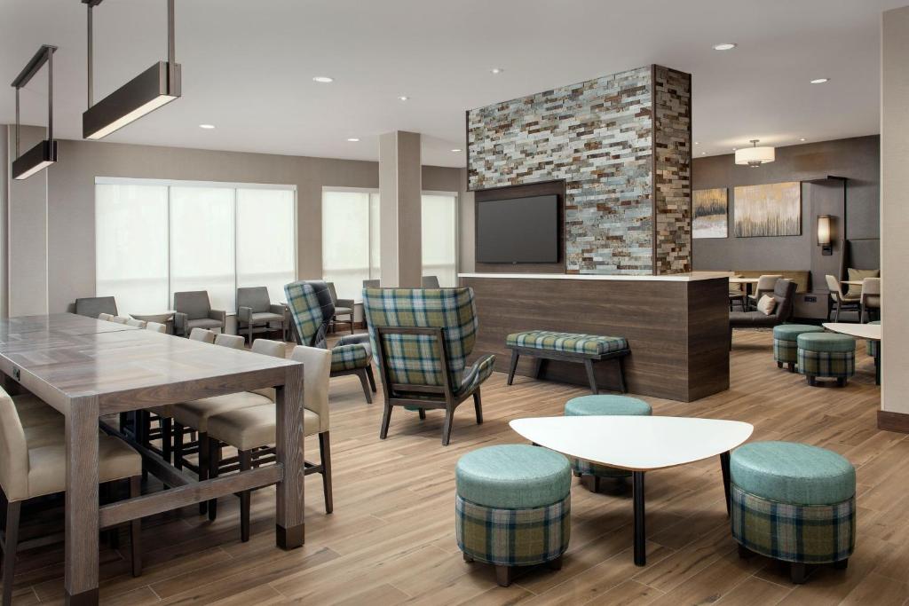 a dining room with a table and chairs at Residence Inn by Marriott Jacksonville Downtown in Jacksonville