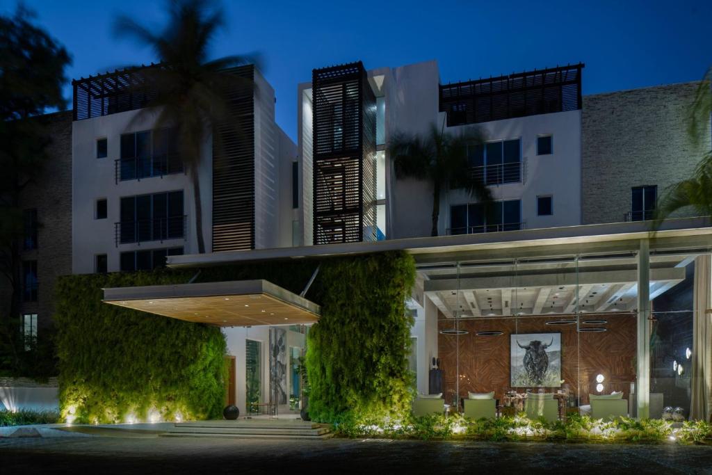 a rendering of a building at night at The Ocean Club, a Luxury Collection Resort, Costa Norte in Sosúa