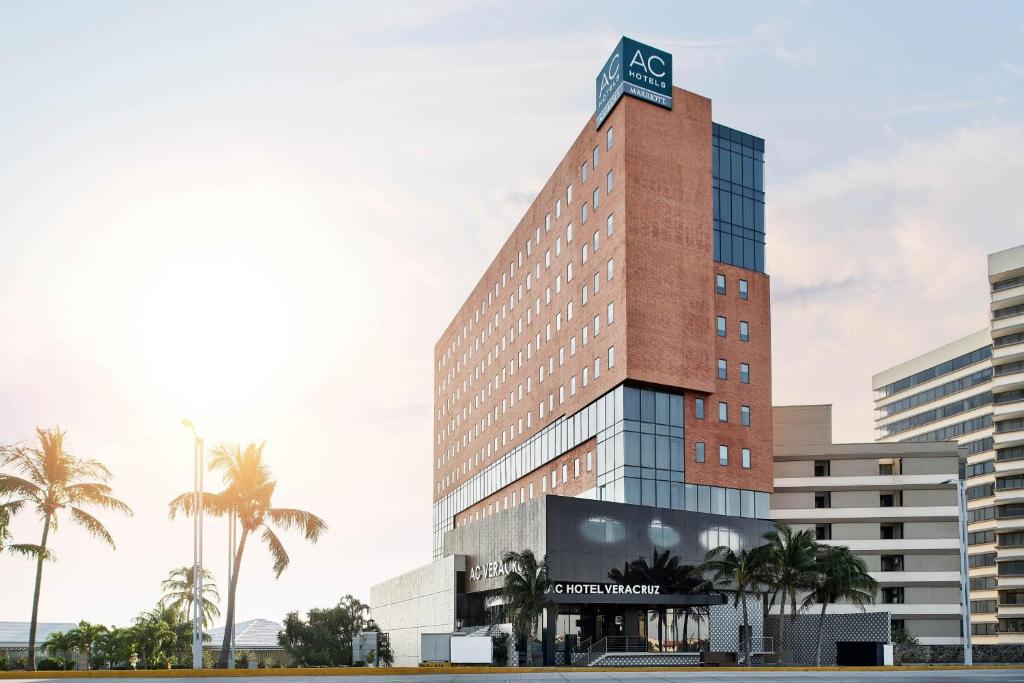 a tall building with a sign on top of it at AC Hotel by Marriott Veracruz in Veracruz