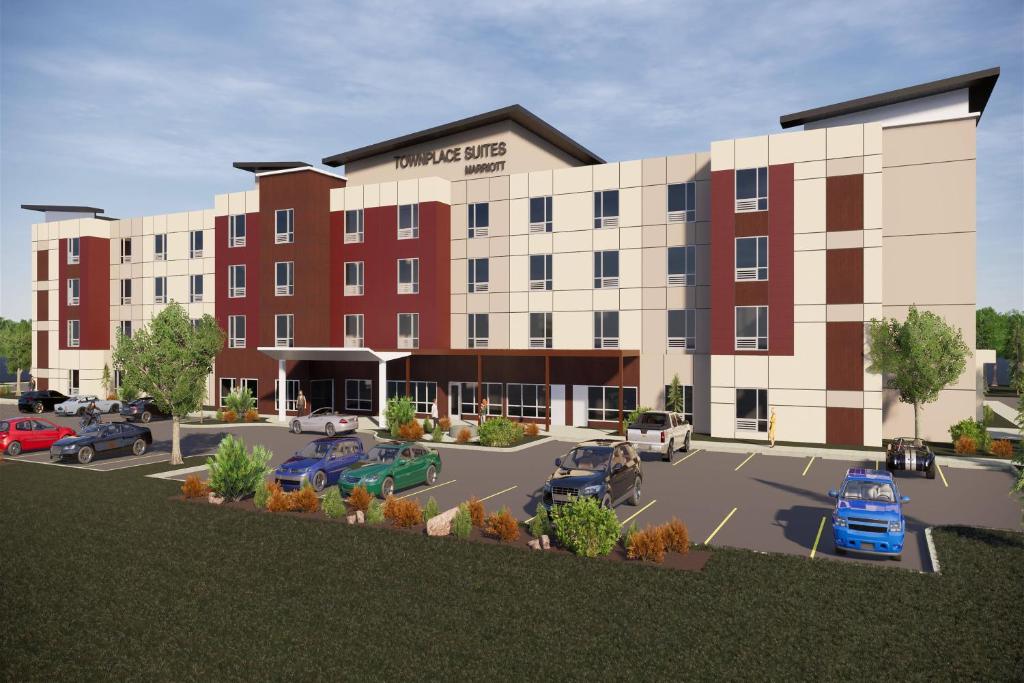 a rendering of a hotel with cars parked in a parking lot at TownePlace Suites by Marriott Medicine Hat in Medicine Hat