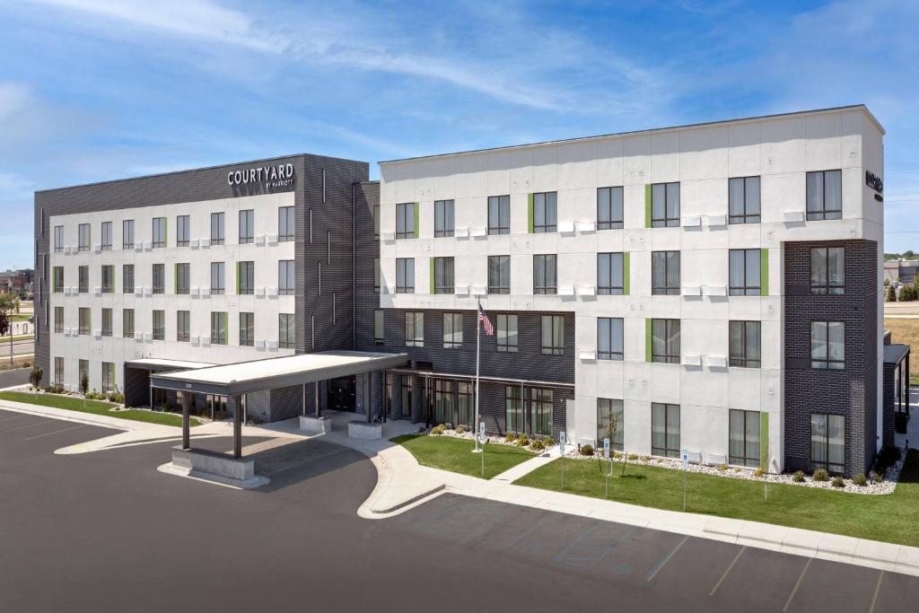 a rendering of the front of a building at Courtyard by Marriott Fargo in Fargo