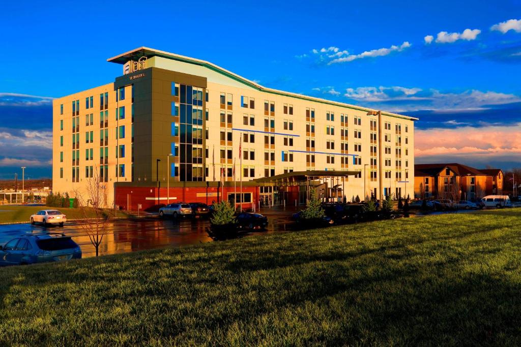 a large building with a parking lot in front of it at Aloft Mount Laurel in Mount Laurel