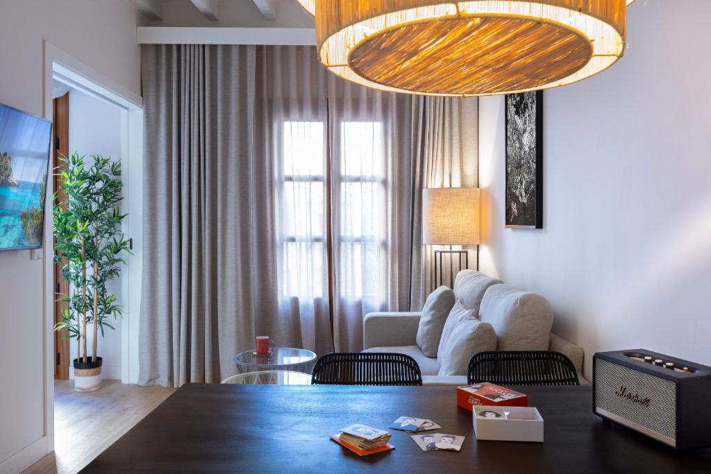 a living room with a couch and a table at Samaritana Suites in Palma de Mallorca