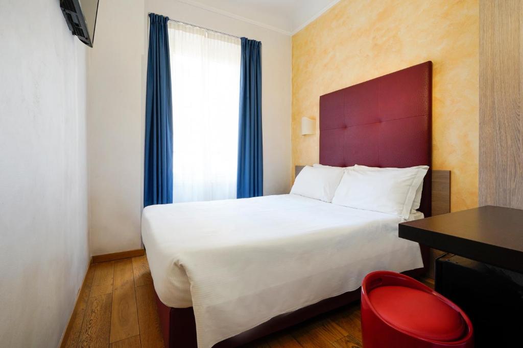 Postel nebo postele na pokoji v ubytování Hotel Panizza