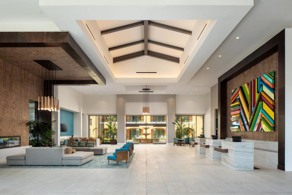 a lobby of a hotel with couches and chairs at Sheraton Carlsbad Resort & Spa in Carlsbad