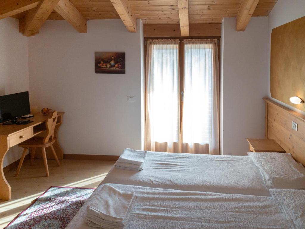 Postel nebo postele na pokoji v ubytování Agritur al Vigneto