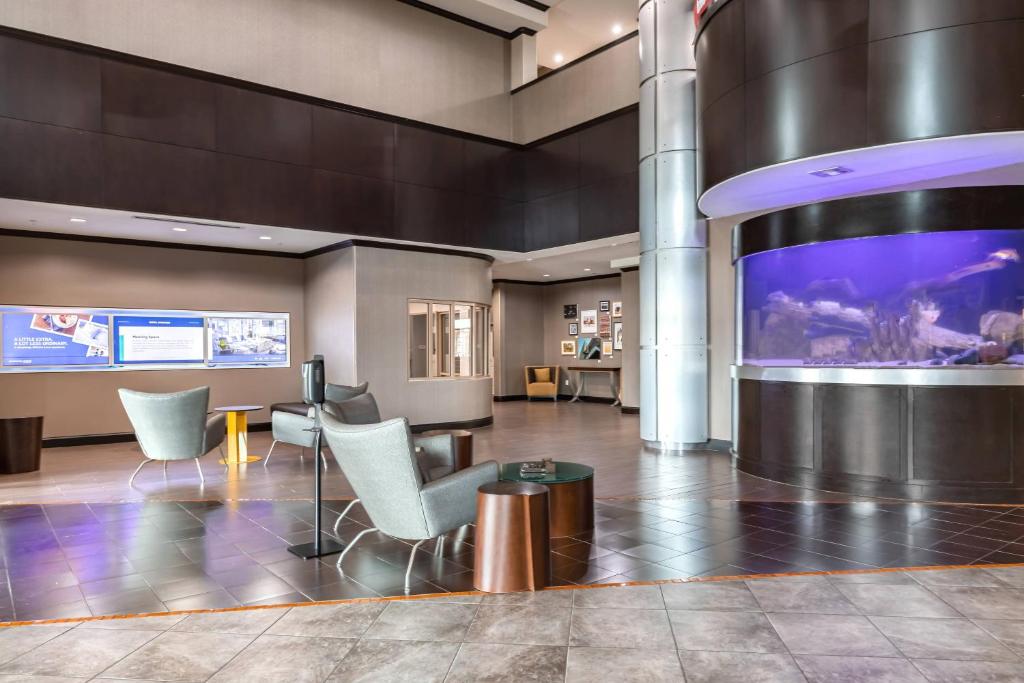 a lobby with a large screen in a building at SpringHill Suites by Marriott Waco Woodway in Woodway