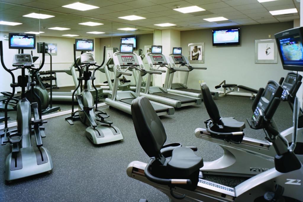 a gym with many cardio machines and televisions at Residence Inn by Marriott New York Manhattan/Times Square in New York