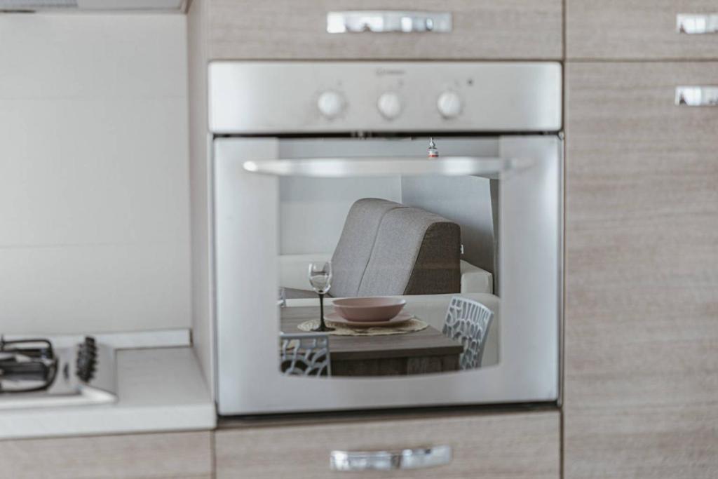 A kitchen or kitchenette at App. Mimosa Minerva Holiday Home