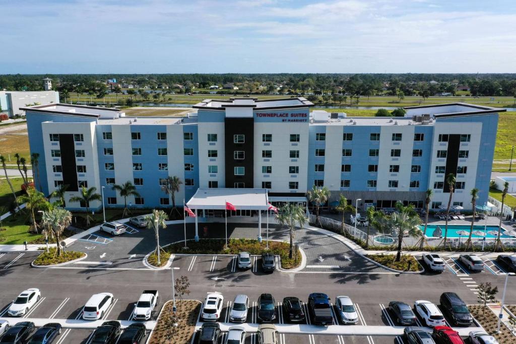 an aerial view of a hotel with cars parked in a parking lot at TownePlace Suites Port St. Lucie I-95 in Port Saint Lucie