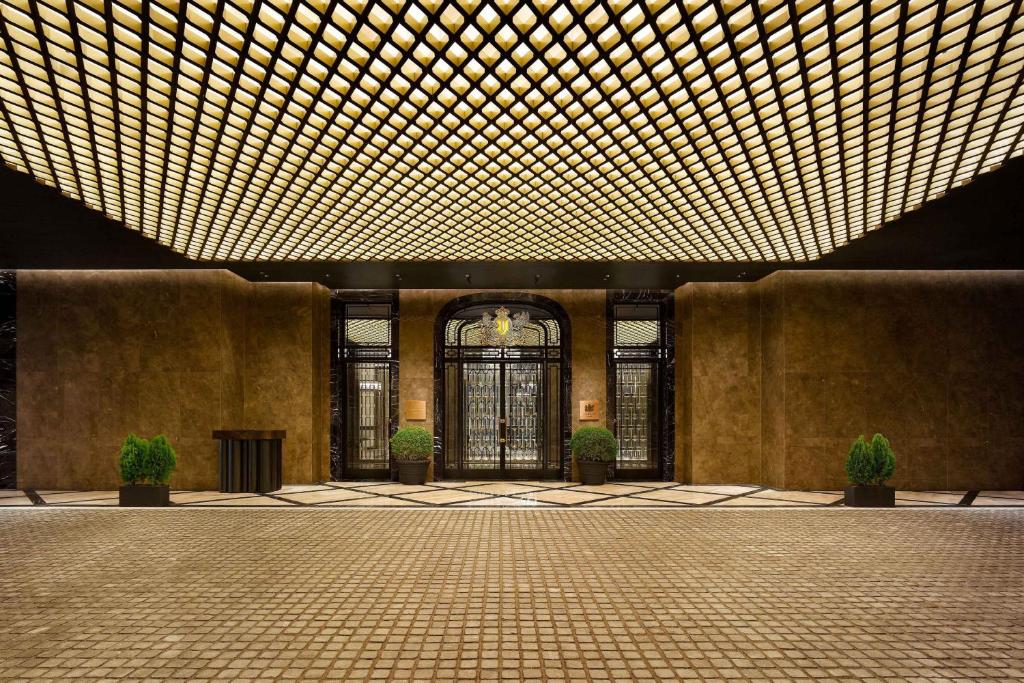a large lobby with a large ceiling with lights at Josun Palace, a Luxury Collection Hotel, Seoul Gangnam in Seoul
