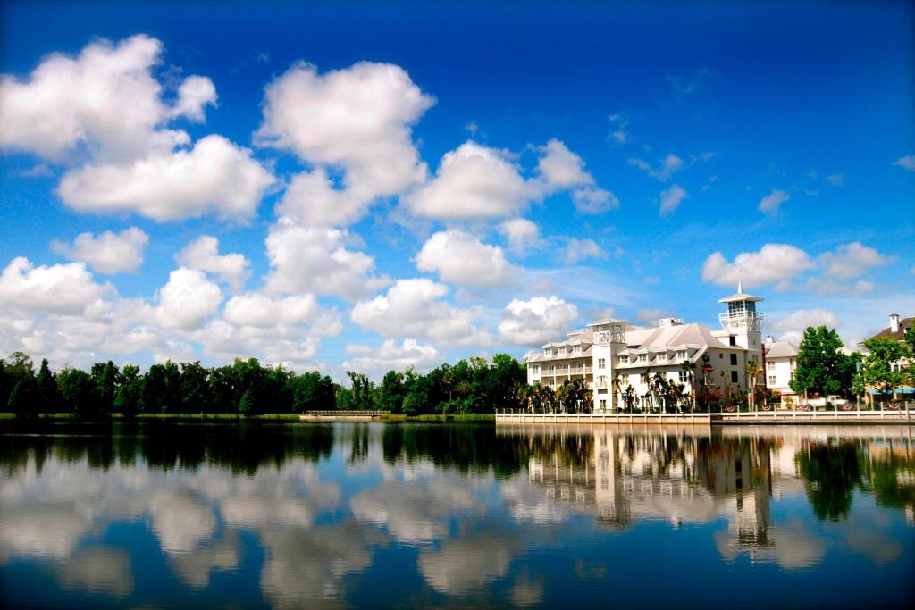 a large building sitting next to a large body of water at Celebration Hotel in Orlando