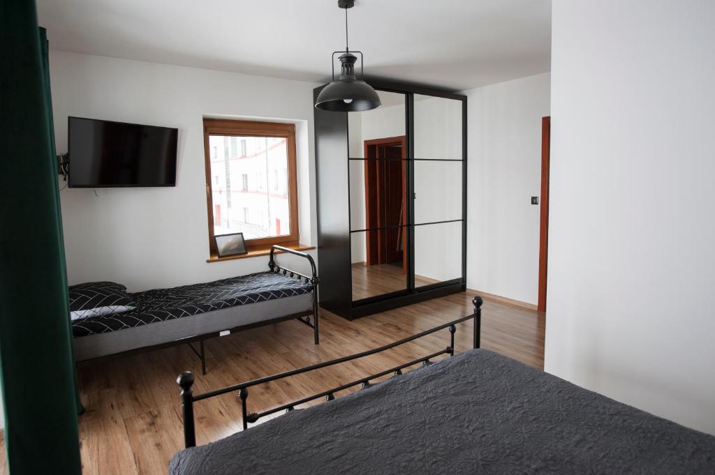 Posteľ alebo postele v izbe v ubytovaní KANIA Apartamenty - Zakopane