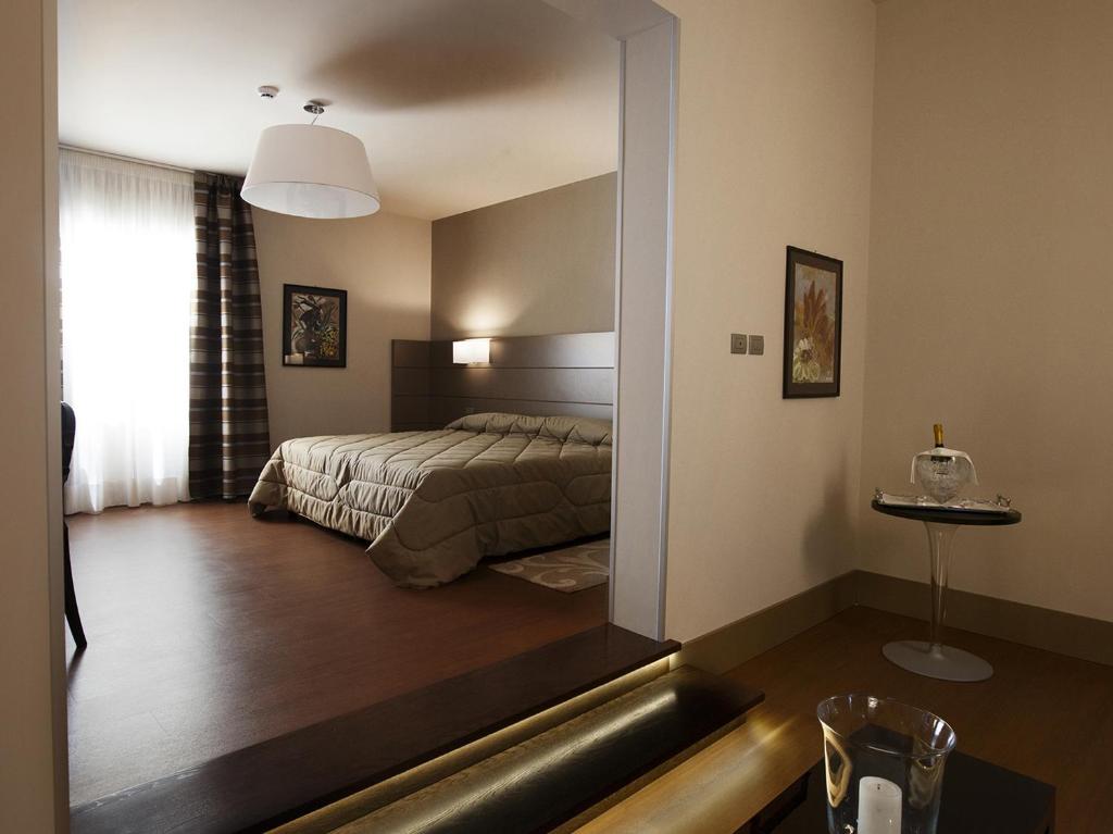 Postel nebo postele na pokoji v ubytování Hotel Vittoria