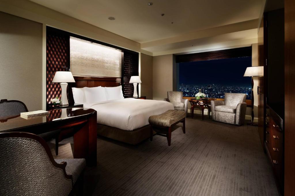 Postel nebo postele na pokoji v ubytování The Ritz-Carlton, Tokyo