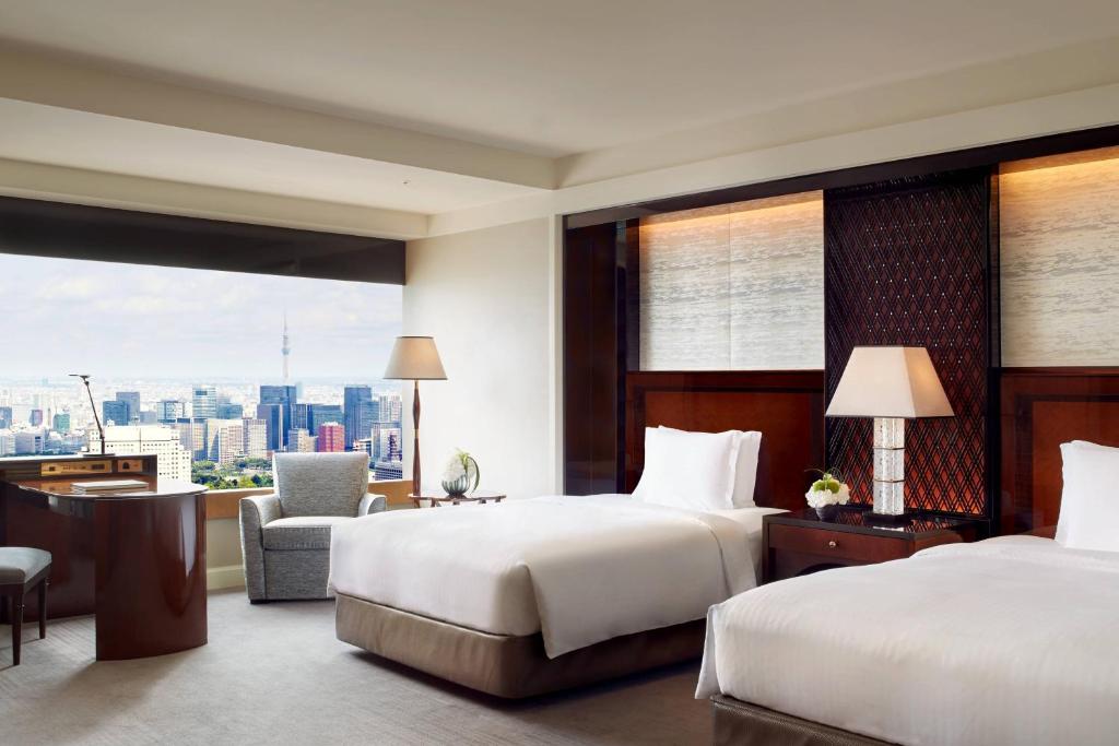 Postel nebo postele na pokoji v ubytování The Ritz-Carlton, Tokyo