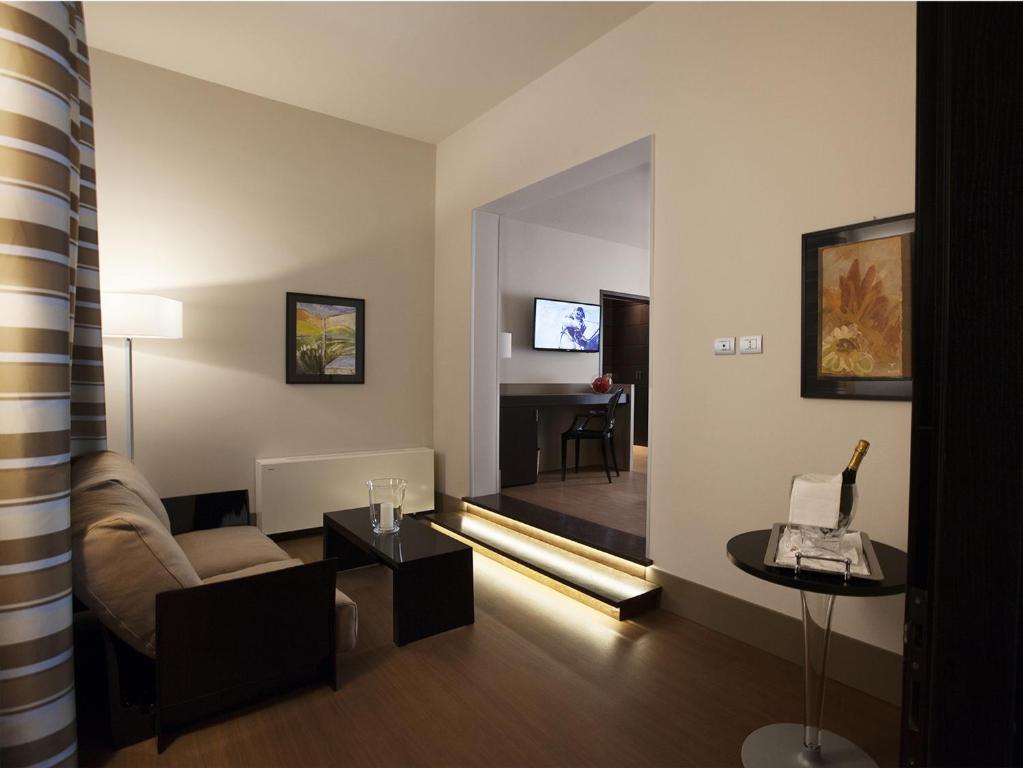 TV a/nebo společenská místnost v ubytování Hotel Vittoria