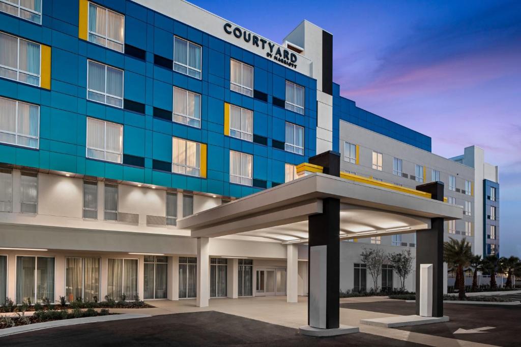 a rendering of the front of a hotel at Courtyard By Marriott Titusville Kennedy Space Center in Titusville