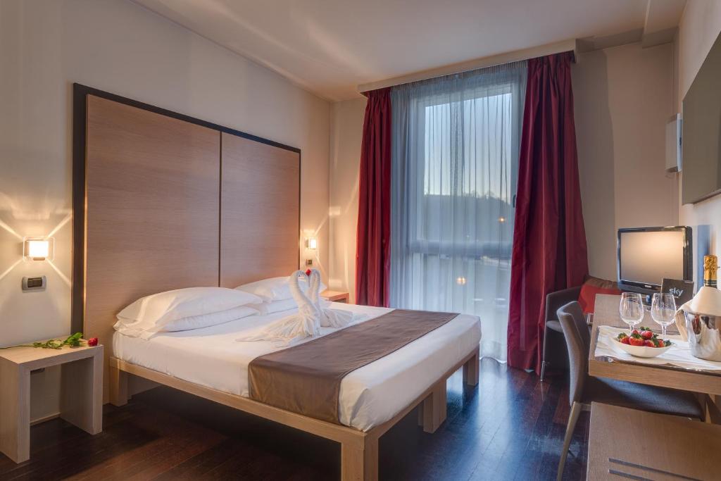 Posteľ alebo postele v izbe v ubytovaní Best Western Hotel San Marco