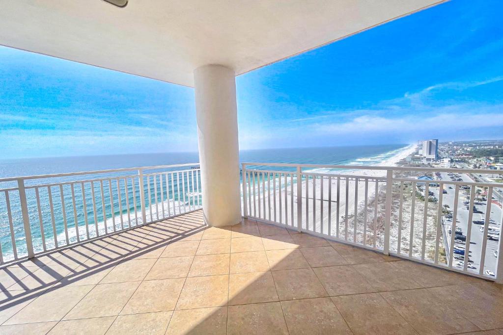 a balcony with a view of the beach and the ocean at Sterling Reef 1407 in Panama City Beach