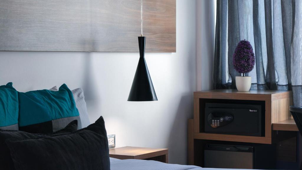 Postel nebo postele na pokoji v ubytování Hotel Blue Concept