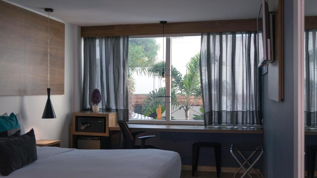 Postel nebo postele na pokoji v ubytování Hotel Blue Concept