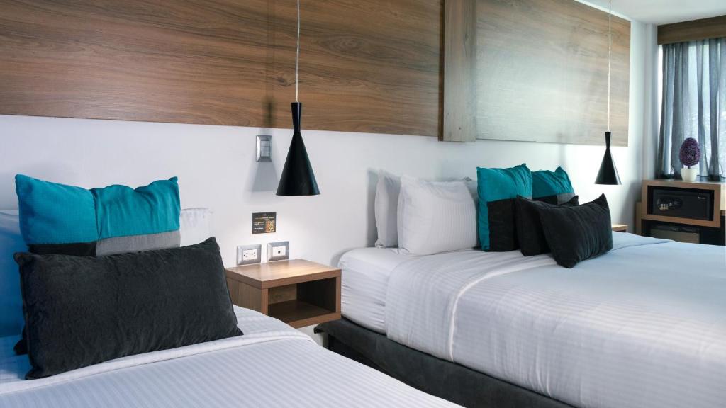 Postel nebo postele na pokoji v ubytování Hotel Blue Concept
