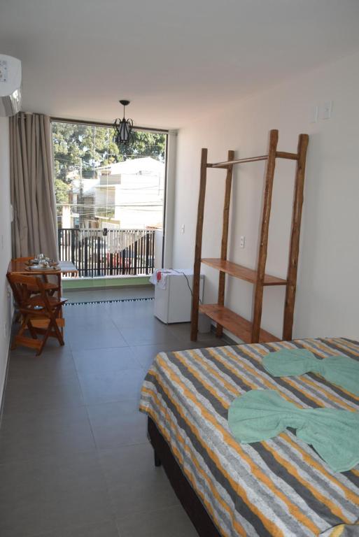 Postel nebo postele na pokoji v ubytování Residencial Lucernaré - Resende