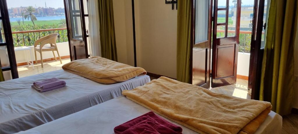 Postel nebo postele na pokoji v ubytování DREAM ISLAND Hotel