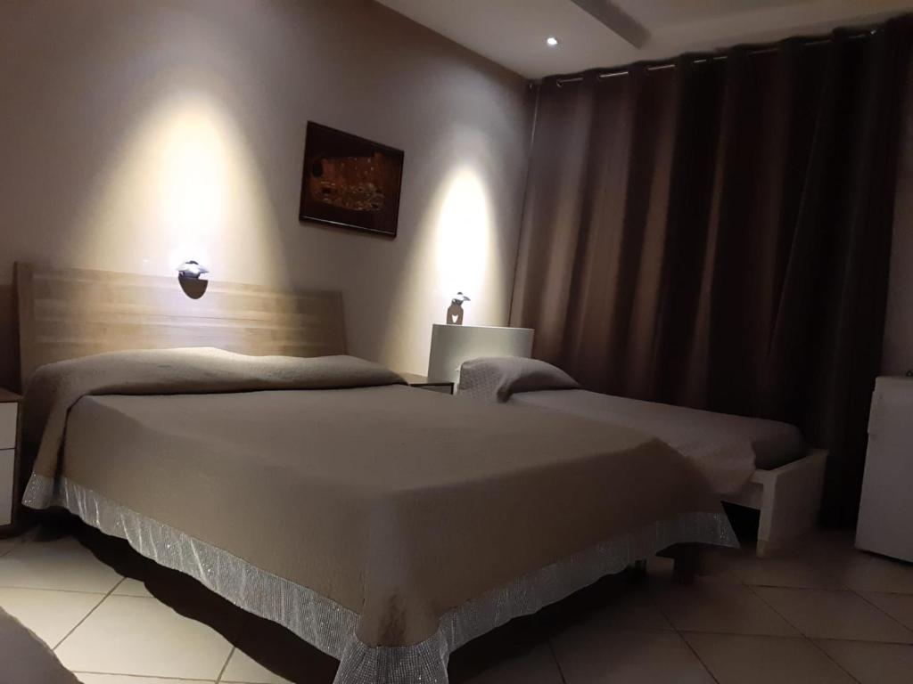 Postel nebo postele na pokoji v ubytování B&B Caffè