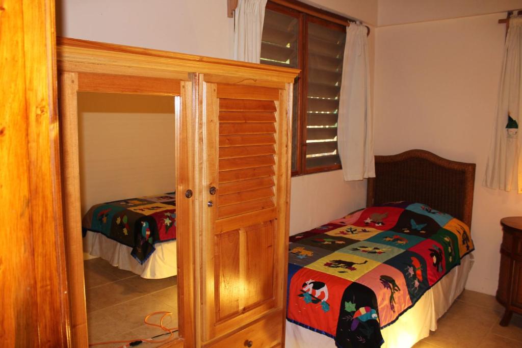 Postel nebo postele na pokoji v ubytování Villas Pico Bonito