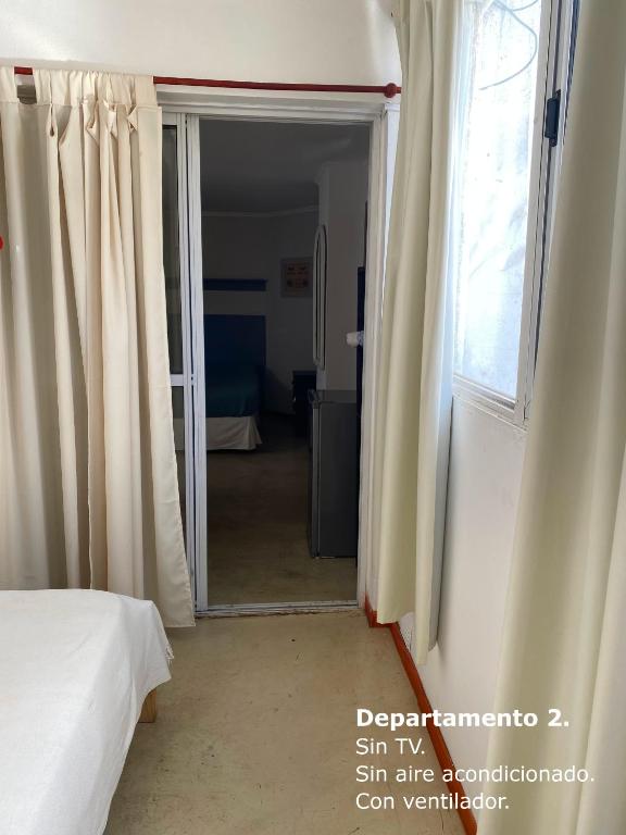 Postel nebo postele na pokoji v ubytování Sarmiento Monoambiente