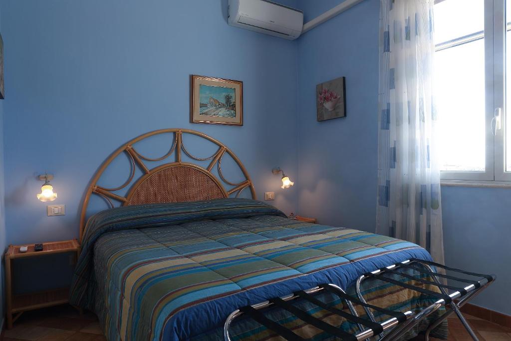 Postel nebo postele na pokoji v ubytování Villa dei giardini