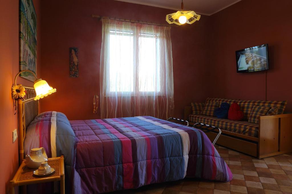 Postel nebo postele na pokoji v ubytování Villa dei giardini