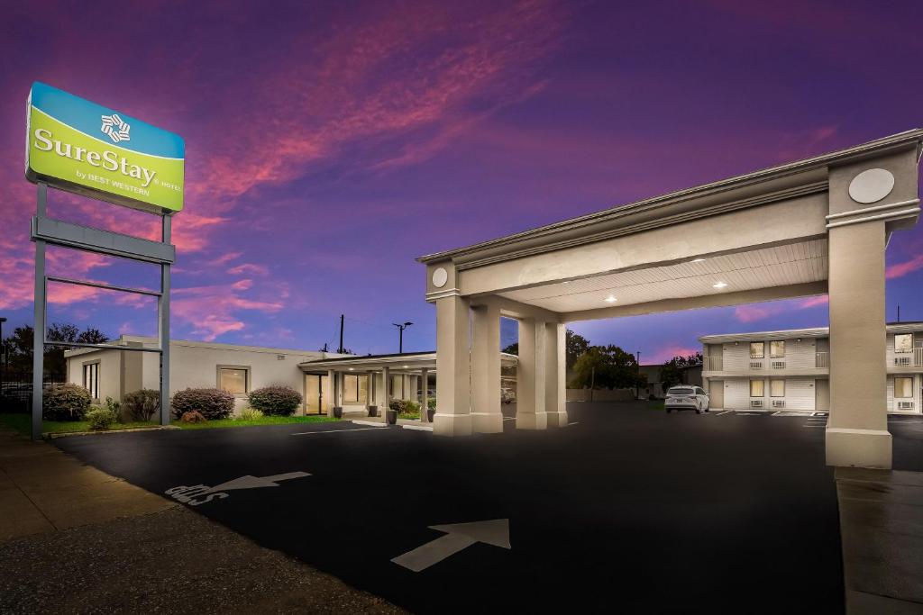 a building with a sign in a parking lot at SureStay Hotel by Best Western Columbus Downtown in Columbus