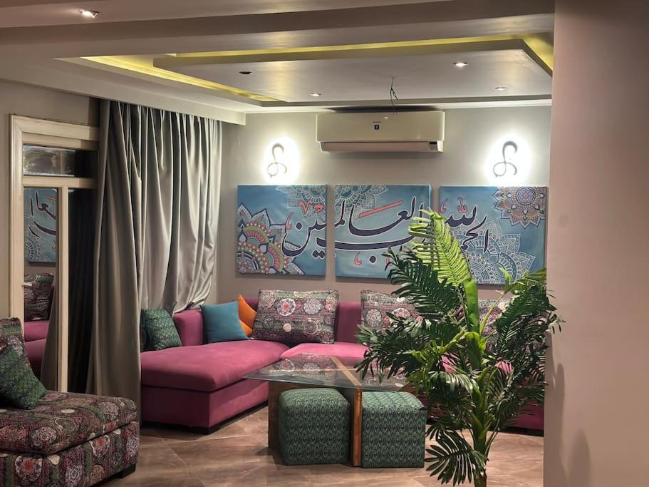 Χώρος καθιστικού στο Apartment view wide garden at Madinaty