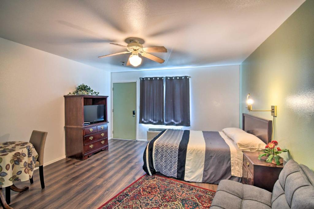 a bedroom with a bed and a ceiling fan at Loveland Vacation Rental Pets Welcome in Loveland