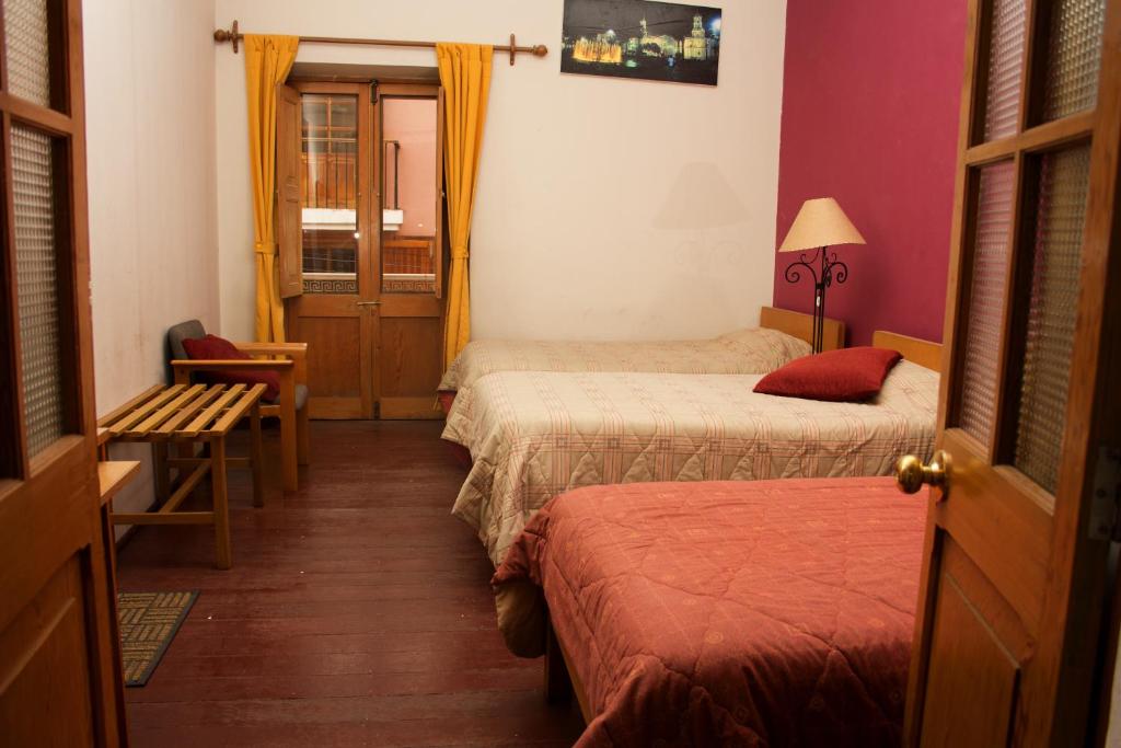 Postel nebo postele na pokoji v ubytování Posada Nueva España