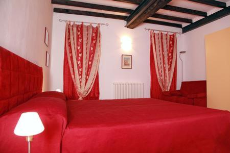 A bed or beds in a room at Il Sipario
