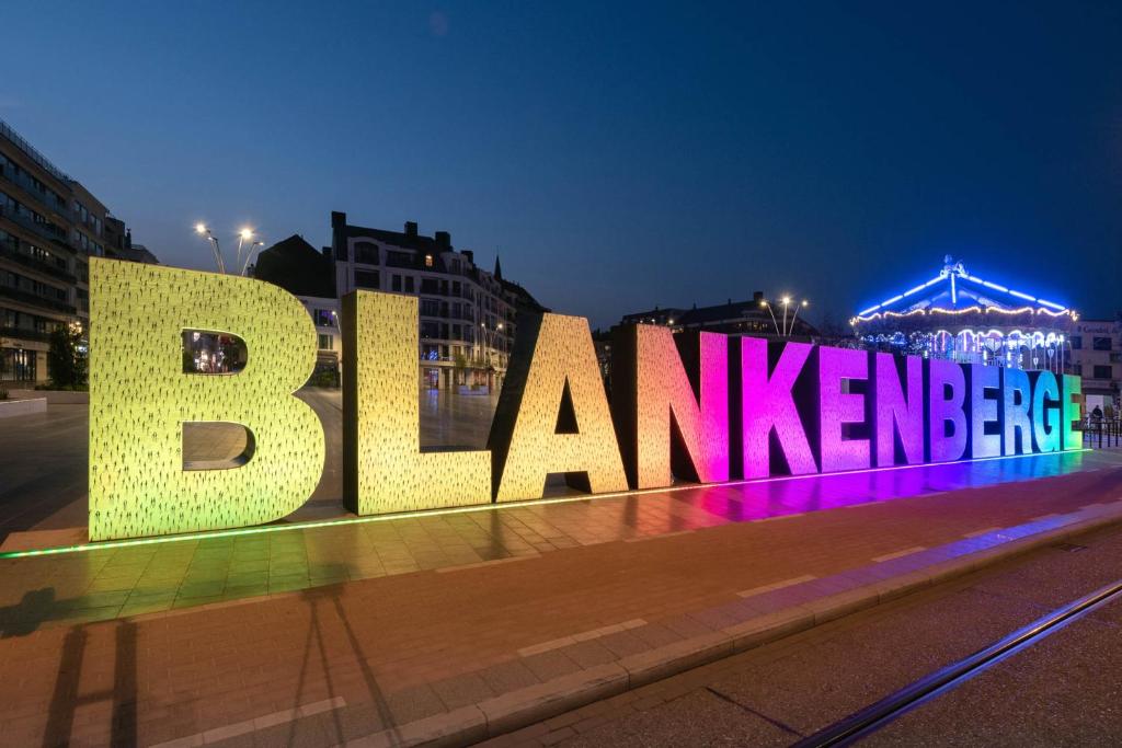 a large sign that says brazil interpreter in a city at night at R&N Sea Breeze in Blankenberge