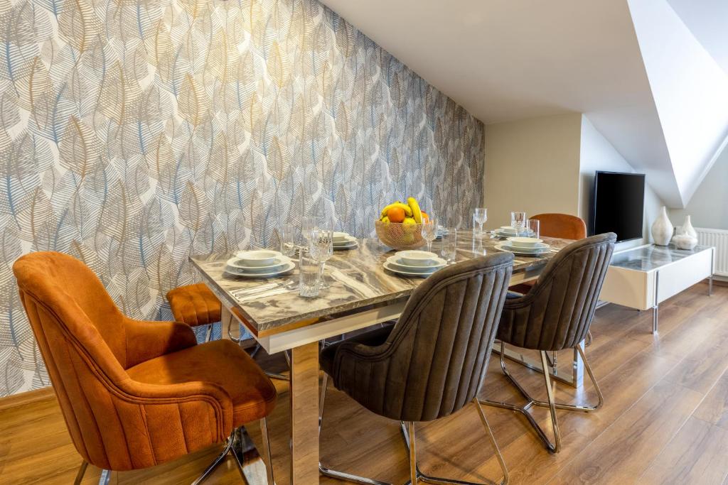 a dining room with a table and chairs at BayMari Suites Plus Florya in Istanbul