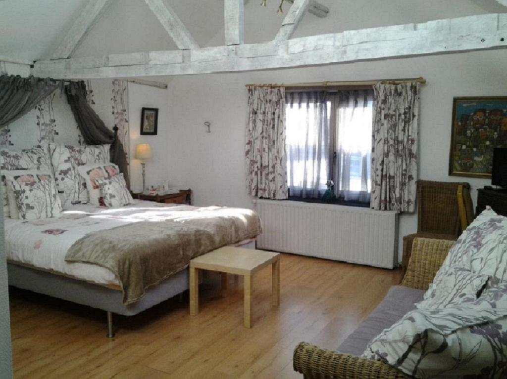 Postel nebo postele na pokoji v ubytování Hotel Het Wethuys