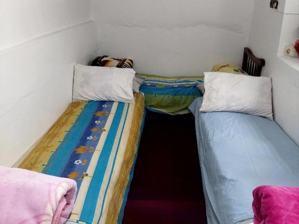 Postel nebo postele na pokoji v ubytování Riad Dar Zouhair