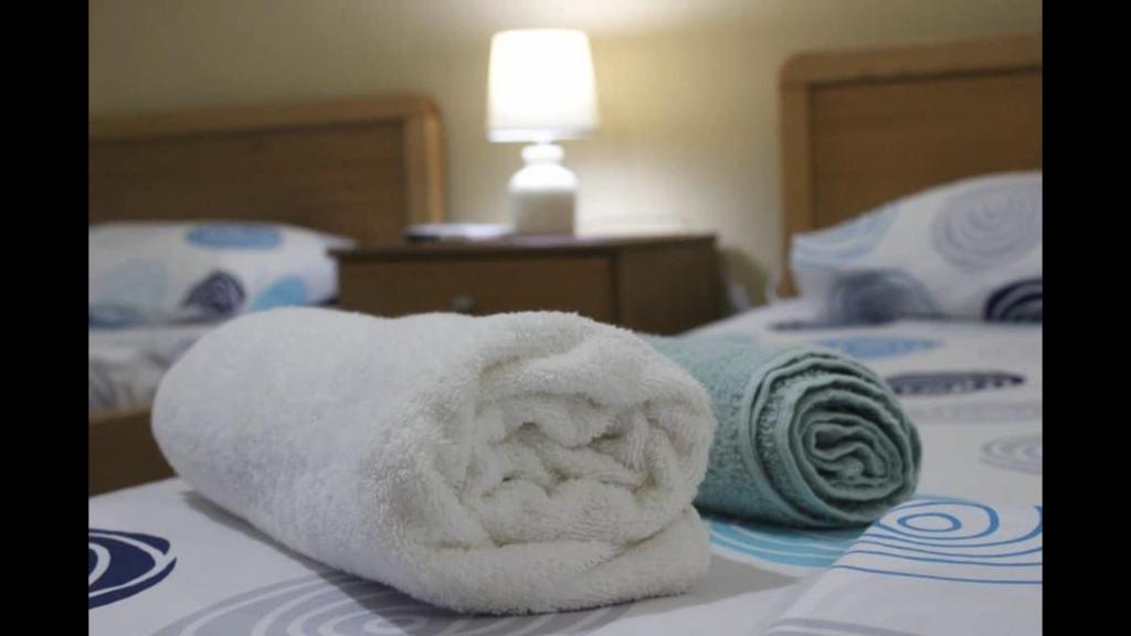Postel nebo postele na pokoji v ubytování Zenstay Hotel