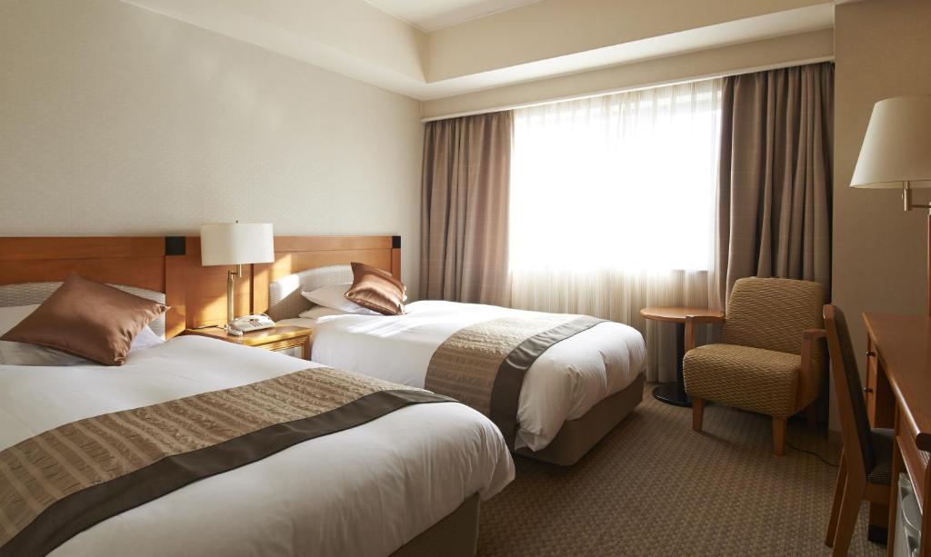 Postel nebo postele na pokoji v ubytování HOTEL VISCHIO AMAGASAKI by GRANVIA