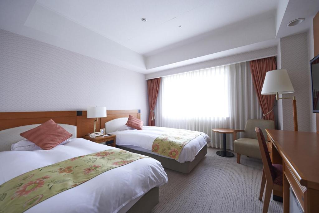 Postel nebo postele na pokoji v ubytování HOTEL VISCHIO AMAGASAKI by GRANVIA