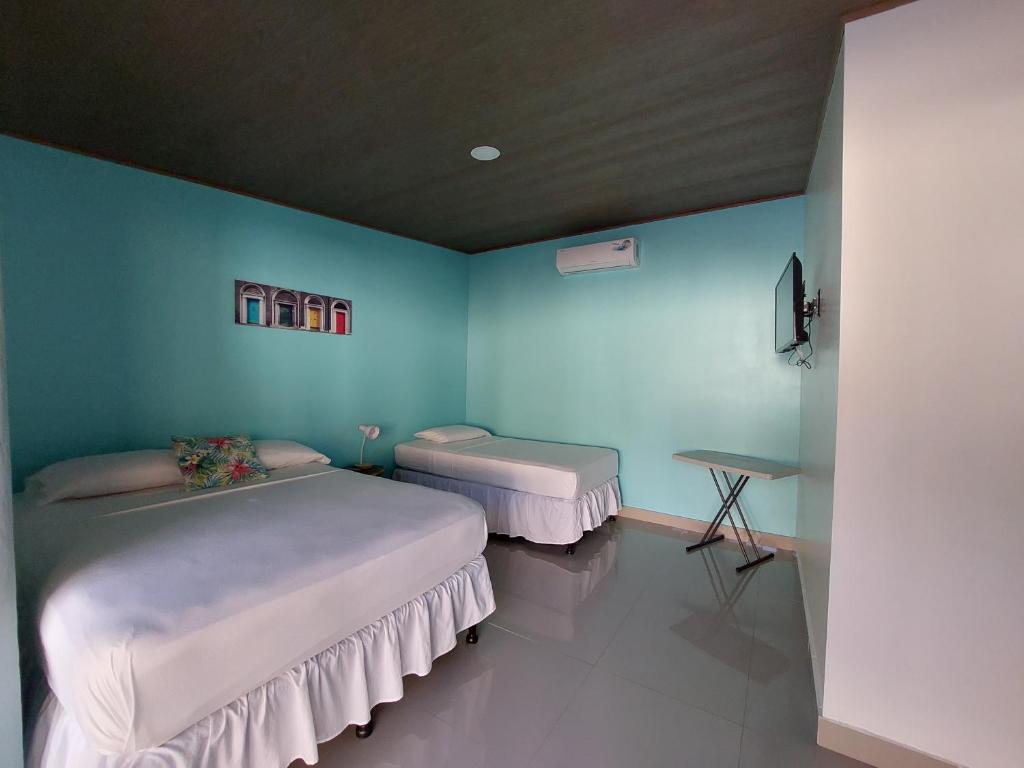 Postel nebo postele na pokoji v ubytování Hotel Carlota Tamarindo