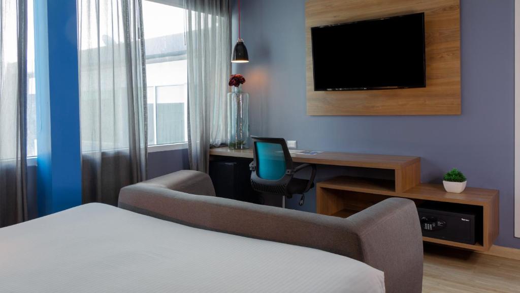 TV a/nebo společenská místnost v ubytování Hotel Blue Concept